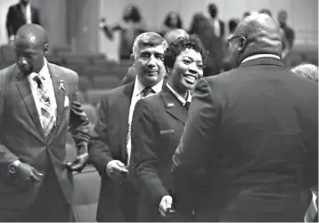  ?? Associated Press ?? ■ In this Wednesday photo, Dallas Police Chief U. Renee Hall greets bishop T.D. Jakes after an event for Hall to take the ceremonial oath of office at the Latino Cultural Center in Dallas.