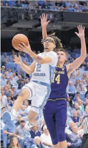  ?? GERRY BROOME/ASSOCIATED PRESS ?? North Carolina’s Cole Anthony (2) drives past Notre Dame’s Nate Laszewski during the Tar Heels’ win over the Irish Wednesday.