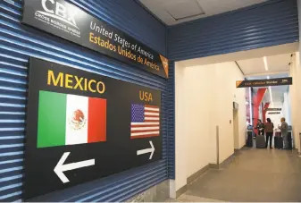  ?? Benedicte Desrus / Sipa USA / TNS ?? Travelers leave Mexico for the U.S. on the Cross Border Xpress pedestrian bridge in Tijuana.