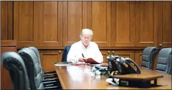  ?? (AP) ?? In this image released by the White House, President Donald Trump works in his conference room at Walter Reed National Military Medical Center in Bethesda, Maryland on
Oct 3, after testing positive for COVID-19.