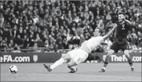  ?? DARREN STAPLES / REUTERS ?? Harry Kane scores England’s 85th-minute winner against Croatia at Wembley in London on Sunday. The host triumphed 2-1 to reach the UEFA Nations League semifinals.