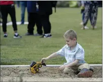  ?? ?? Using a toy bulldozer, William Camp, 5, of Vacaville at Transition­al Kindergart­en student at Kairos Public School holds his own groundbrea­king ceremony Friday in Nashe Mesto Park.