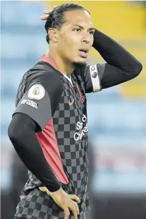  ??  ?? Liverpool’s Dutch defender Virgil van Dijk reacts after they concede their seventh goal during the English Premier League football match between Aston Villa and Liverpool at Villa Park in Birmingham, central England, yesterday.