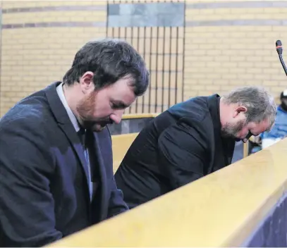  ?? Picture: Gallo Images ?? DOWNCAST. Farm workers Pieter Doorewaard and Phillip Schutte following the guilty verdict on the murder of Matlhomola Mosweu on Wednesday at the North West High Court in Mahikeng.