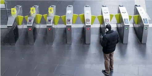  ?? Photo / Bloomberg ?? Downtown Melbourne’s Flinders St station is almost deserted, thanks to the Covid-19 lockdown.