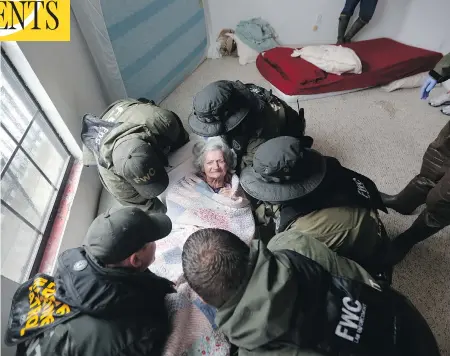  ?? GERALD HERBERT / THE ASSOCIATED PRESS ?? Rescue officials work to remove an elderly resident from the Golden Years Assisted Living home in Orange, Texas in August after the home was flooded by hurricane Harvey. Approximat­ely 4,000 patients in more than 160 nursing homes and assisted living...