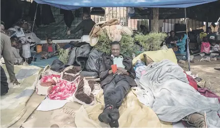  ?? Picture: Jacques Nelles ?? HOMESICK. Heritier Mutiaka from the Democratic Republic of the Congo is one of the 620 refugees from various African countries camping outside the offices of the United Nations High Commission­er for Refugees in Pretoria, yesterday. The increasing group of foreign nationals have been there for more than three weeks, wanting to be moved out of the country for fear of xenophobic violence.