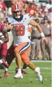  ?? PHIL SEARS/AP ?? Syracuse quarterbac­k Garrett Shrader, seen in a 2021 game against Florida State, will miss the Boca Raton Bowl after undergoing shoulder surgery.