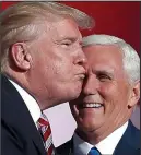  ??  ?? Air kiss: Donald Trump tries to greet running mate Mike Pence