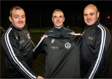  ??  ?? Niall Teather, from Fit Kids presenting managers Fergal Kindlon and Carl Dearey of Quay Celtic under 12 with their new team tracksuits.