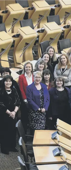  ??  ?? 0 Scotland’s women MSPS gather in Holyrood to celebrate 100 years of female suffrage – but they make up just 36% of MSPS – with not a single Lib Dem among them