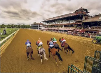  ?? Skip Dickstein / Times Union archive ?? The first race of the 2020 meeting breaks the gate to empty stands at Saratoga Race Course in Saratoga Springs. It is not clear yet whether fans will be permitted this year.