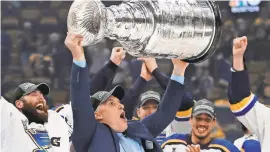  ?? WINSLOW TOWNSON/USA TODAY ?? After being elevated to coach in November 2018 by the Blues, Craig Berube hoisted the Stanley Cup.