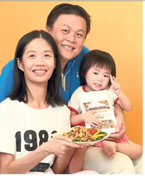 ?? — NORAFIFI EHSAN/The Star ?? Chye (left) and husband Choon now make the veggie pasta together and say they derive great satisfacti­on when their children and other kids eat their pasta. Pictured here is their cute little two-year-old daughter Regina.