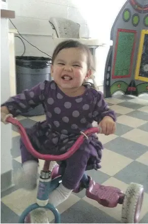  ??  ?? News coverage of the death of Serenity, shown here as a happy toddler riding her trike, prompted the creation of the Ministeria­l Panel on Child Interventi­on, though the panel members cannot discuss specific cases.