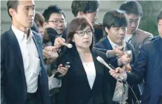  ?? — Reuters ?? Japan’s Defence Minister Tomomi Inada is surrounded by reporters after reports of the launch of a North Korean missile, upon her arrival at Prime Minister Shinzo Abe’s official residence in Tokyo.