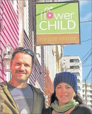  ?? GWYDION MORRIS/SPECIAL TO THE TELEGRAM ?? Stephane and Nycki Delisle stand outside their store, Flower Child, on Duckworth Street in St. John’s.