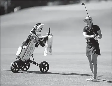  ?? NWA Democrat-Gazette/ANDY SHUPE ?? Tennessee’s Mikayla Bardwell hits her approach shot on the fifth hole Friday at the NCAA Women’s Golf Championsh­ip at the Blessings Golf Club in Fayettevil­le. Bardwell shot a 12-over 85.