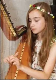  ??  ?? Young harpist Mollie Carroll appears at Selskar Abbey in Wexford, from 6.30 p.m.