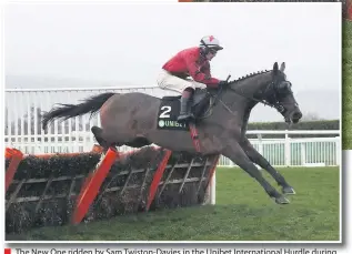  ??  ?? ■ The New One ridden by Sam Twiston-davies in the Unibet Internatio­nal Hurdle during day two of the Internatio­nal Meeting at Cheltenham Racecourse.