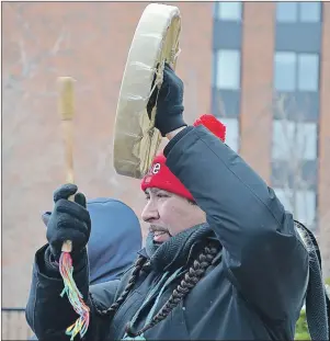  ?? ELIZABETH PATTERSON/CAPE BRETON POST ?? Jeff Ward from Membertou beats a traditiona­l drum during a rally in Sydney on Saturday afternoon, part of a national weekend of protests, against Islamophob­ia and deportatio­ns.