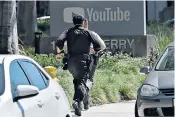  ??  ?? Police officers approach the scene of the shooting at the headquarte­rs of Youtube in San Bruno, California. Top right, workers – hands on heads – leave a building, and, above right, Ed Barberini, San Bruno police chief, speaks to members of the media