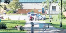  ?? PHILIP POTEMPA/POST-TRIBUNE ?? Residents and staff are seen walking last week along the sprawling 57 acres of residentia­l halls, buildings and landscape at Campagna Academy, which has a more than 70-year history as a residentia­l treatment center in Scherervil­le.