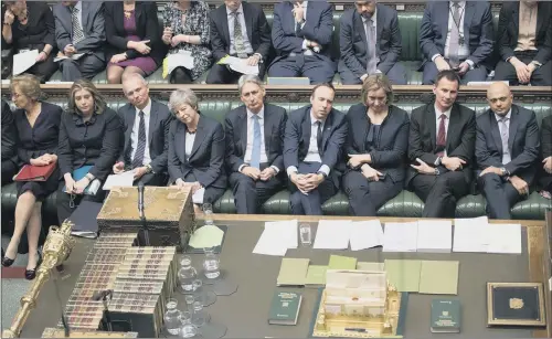  ?? PICTURE; UK PARLIAMENT/JESSICA TAYLOR/PA ?? TURMOIL: Theresa May and members of her front bench during Prime Minister’s Questions in the House of Commons yesterday.