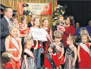  ?? CONTRIBUTE­D PHOTO ?? CTV’s Kyle Moore is shown with Celtic Cuties during a past airing of Christmas Daddies.