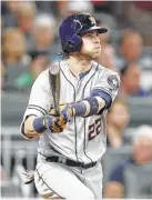  ?? Mike Zarrilli / Getty Images ?? Josh Reddick launches a two-run double during the Astros’ fifth inning Wednesday. He had seven RBIs in the two-game series.