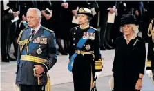  ?? ?? KING Charles III, Princess Anne, Princess Royal and Camilla, Queen Consort pay their respects in The Palace of Westminste­r during the procession for the Lying-in State of Queen Elizabeth II on Tuesday in London. | Reuters