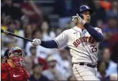  ?? CHARLES KRUPA — THE ASSOCIATED PRESS ?? Houston Astros' Michael Brantley watches his two-run home run next to Boston Red Sox catcher Kevin Plawecki during the second inning at Fenway Park on Tuesday.