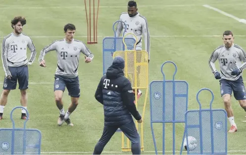  ??  ?? 0 Bayern Munich head coach Hansi Flick oversees a training session earlier this week. Bayern are leading the Bundesliga by four points.