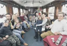  ??  ?? The Andrew and Rose families in their carriage.