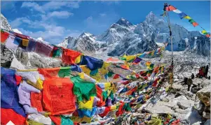  ??  ?? View of Mount Everest and Nuptse with buddhist prayer flags