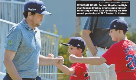  ?? STAFFPHOTO­SBYCHRISCH­RISTO ?? WELCOME HOME: Former Hopkinton High star Keegan Bradley greets some fans after hitting off the 12th tee during his first round yesterday at TPC Boston in Norton.