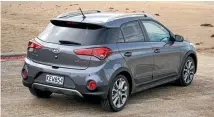  ??  ?? ‘Floating roof’, courtesy of blacked-out D-pillar, is very-2017. Roof spoiler is unique to Cross version of i20.