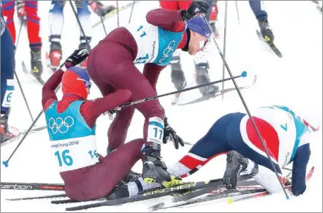  ?? ODD ANDERSEN/AFP ?? Russia’s Denis Spitsov (left), Russia’s Andrey Larkov and Norway’s Simen Hegstad Krueger (right) recover following a collision during the men’s 15km + 15km cross-country skiathlon at the Pyeongchan­g 2018 Winter Olympic Games yesterday.