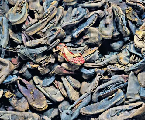  ?? ?? Haunting: shoes from Auschwitz victims. Below, Aryeh Pinsker says we have a moral responsibi­lity to preserve evidence of the Holocaust
