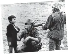  ?? Picture: Getty Images ?? ABOVE A US soldier and a South Vietnamese soldier question a child in a South Vietnamese village in January 1968.
