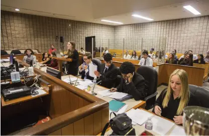  ?? JULIE JOCSAK ST. CATHARINES STANDARD ?? Students from A.N. Myer Secondary School and Denis Morris High School faced off in the final case during a mock trial at the St. Catharines courthouse on Friday. Each team was mentored by a local lawyer or Crown attorney.