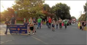  ?? PHOTOS BY LISA MITCHELL - DIGITAL FIRST MEDIA ?? Cub Scout Pack 133 from Richmond Township was among the community groups to participat­e in the Fleetwood Homecoming Parade on Oct. 6.