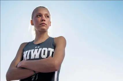  ?? Timothy Hurst / Staff Photograph­er ?? Niwot High School freshman runner Mia Prok poses for a portrait Tuesday.