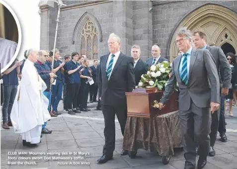  ?? Picture: ALISON WYND ?? CLUB MAN: Mournersou­es wearingeag ttieses in St Mary’s ay footy ooty colours escort Don Mathieson’s coffin from the church.