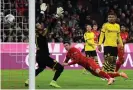  ??  ?? Robert Lewandowsk­i opens the scoring with the first of his two goals in Bayern Munich’s 4-0 win over Borussia Dortmund in November 2019. Photograph: Philipp Guelland/EPA