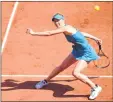  ??  ?? Elina Svitolina plays a forehand return to Ajla Tomljanovi­c during their women's singles first round match on Sunday.