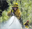  ?? Paul Kitagaki Jr. ?? The Associated Press Fire crews battle the Pawnee Fire on Monday in Spring Valley, Calif.