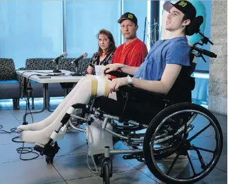  ?? THE CANADIAN PRESS/JEFF MCINTOSH ?? Humboldt Broncos player Ryan Straschnit­zki, who was paralyzed following a bus crash that killed 16 people, speaks to the media as his parents look on in Calgary.