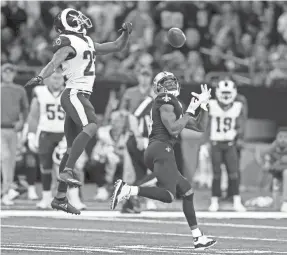  ?? CHUCK COOK/USA TODAY ?? Marcus Peters, left, burned by Saints receiver Michael Thomas on a 72-yard TD catch, says the loss will motivate the Rams to improve.