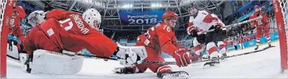  ??  ?? Canada’s Rebecca Johnston (6) scores against Russia in Canada’s 5-0 semifinal win on Monday. Canada plays the United States Thursday for the gold medal. See story on S5.